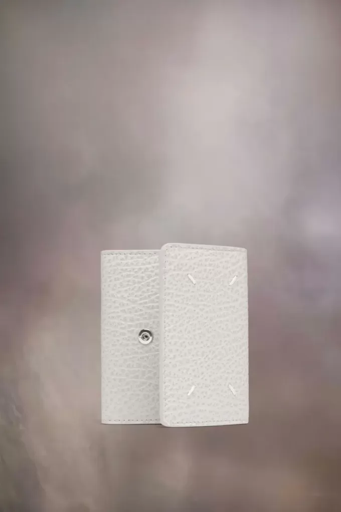 Cartera de cuatro puntadas Cartera de cuatro puntadas