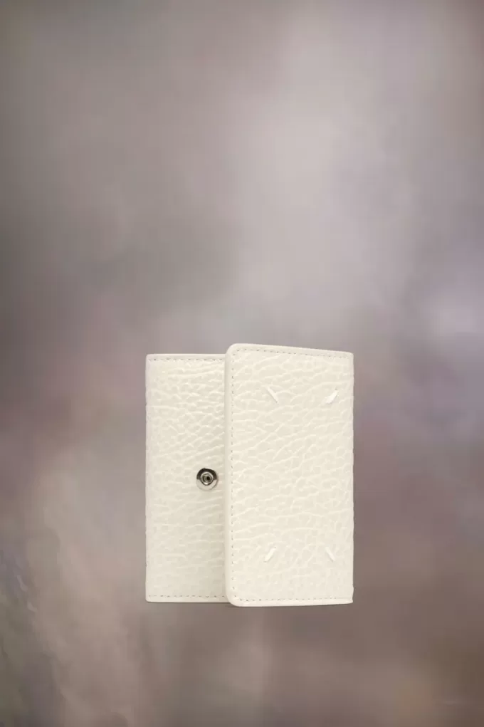 Cartera de cuatro puntadas Cartera de cuatro puntadas