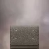 Cartera de cuatro puntadas Cartera de cuatro puntadas