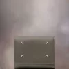 Cartera de cuatro puntadas Cartera de cuatro puntadas