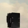 Cartera de cuatro puntadas Cartera de cuatro puntadas