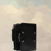 Cartera de cuatro puntadas Cartera de cuatro puntadas