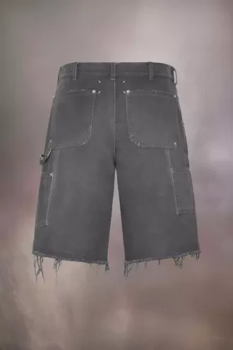 Pantalones cortos vaqueros con tachuelas de Maison Margiela