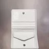 Tarjetero de bolsillo con cuatro puntadas Tarjetero de bolsillo con cuatro puntadas